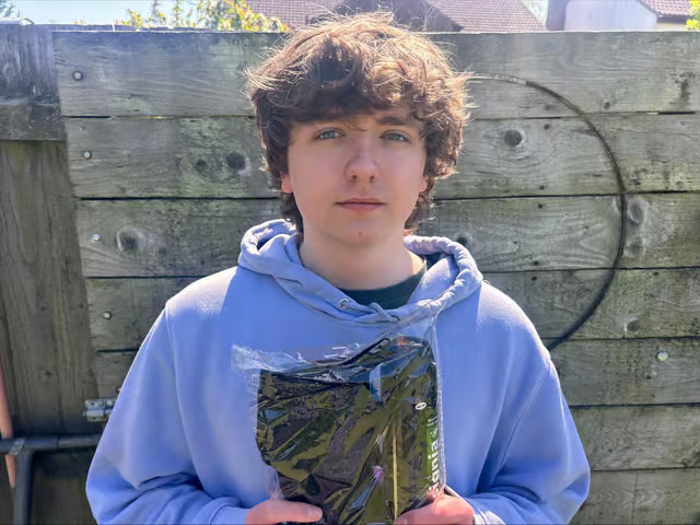 Tom Chalmers with wellbeing pack